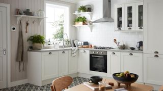 white corner kitchen with built in oven