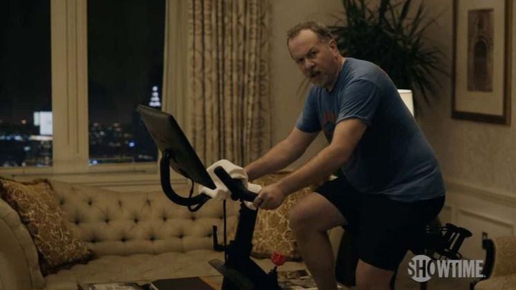 David Costabile riding a Peloton bike in Billions season 6 