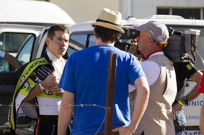 Robert Mennen of Topeak-Ergon is interviewed by TV after crashing into a buck