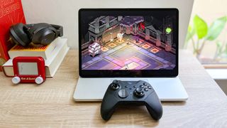 Microsoft Surface Laptop Studio 2 review unit on desk playing Hades