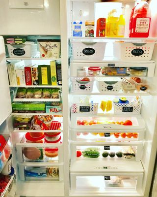 an organized fridge with food labels
