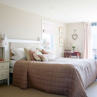 bedroom with bed and white wall