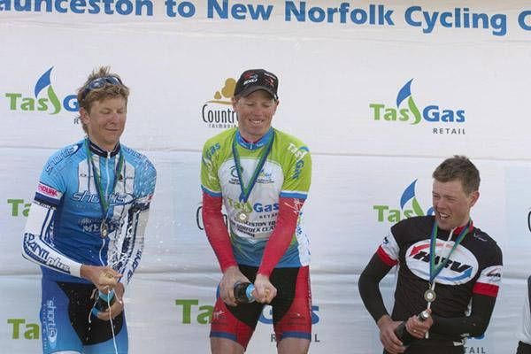 Podium celebrations (l-r): Chris Jory, Patrick Shaw and Eliot Crowther struggle with the champers on the podium in New Norfolk.