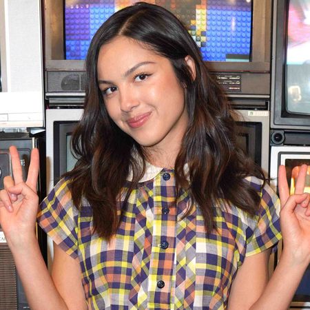 Olivia Rodrigo styles the babydoll dress trend with socks and heeled Mary Janes