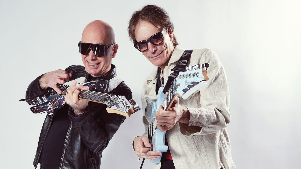 Joe Satriani and Steve Vai pose in a portrait shoot