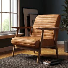Tan leather midcentury armchair with wooden arms and legs.