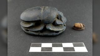 Ancient Egyptian artifacts, such as these scarabs, were found in the man's tomb.