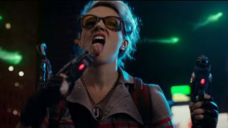 Kate McKinnon licking her weapon in Ghostbusters