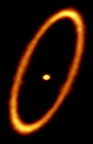 The dusty ring around the Fomalhaut star is clearly visible in this ALMA radio telescope image. The ring is about 12 billion miles (20 billion kilometers) from the star and 1.2 billion (2 billion km) wide.