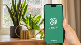 ChatGPT on phone in front of house plants