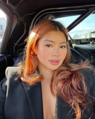 An image of influencer @alllisonho with copper hair.