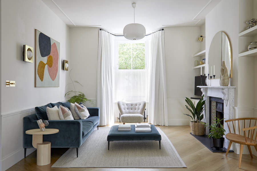 A well-lit living room with wooden flooring