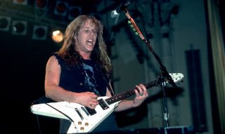 James Hetfield performs onstage with Metallica at the Aragon Ballroom in Chicago, Illinois on February 9, 1985