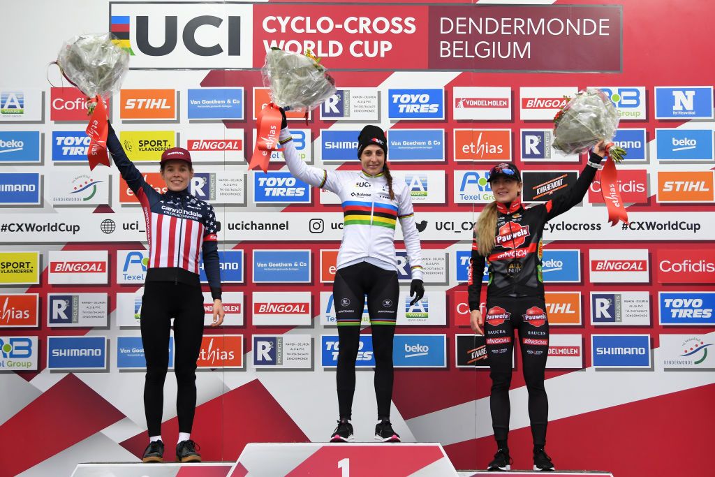 DENDERMONDE BELGIUM DECEMBER 26 LR Clara Honsinger of The United States and Team CannondaleCyclocrossworld on second place race winner Lucinda Brand The Netherlands and Team Baloise Trek Lions and Denise Betsema of The Netherlands and Team Pauwels Sauzen Bingoal on third place pose on the podium ceremony after the 2nd Dendermonde UCI CycloCross Worldcup 2021 Womens Elite CXWorldCup UCIcyclocrossWC on December 26 2021 in Dendermonde Belgium Photo by Luc ClaessenGetty Images