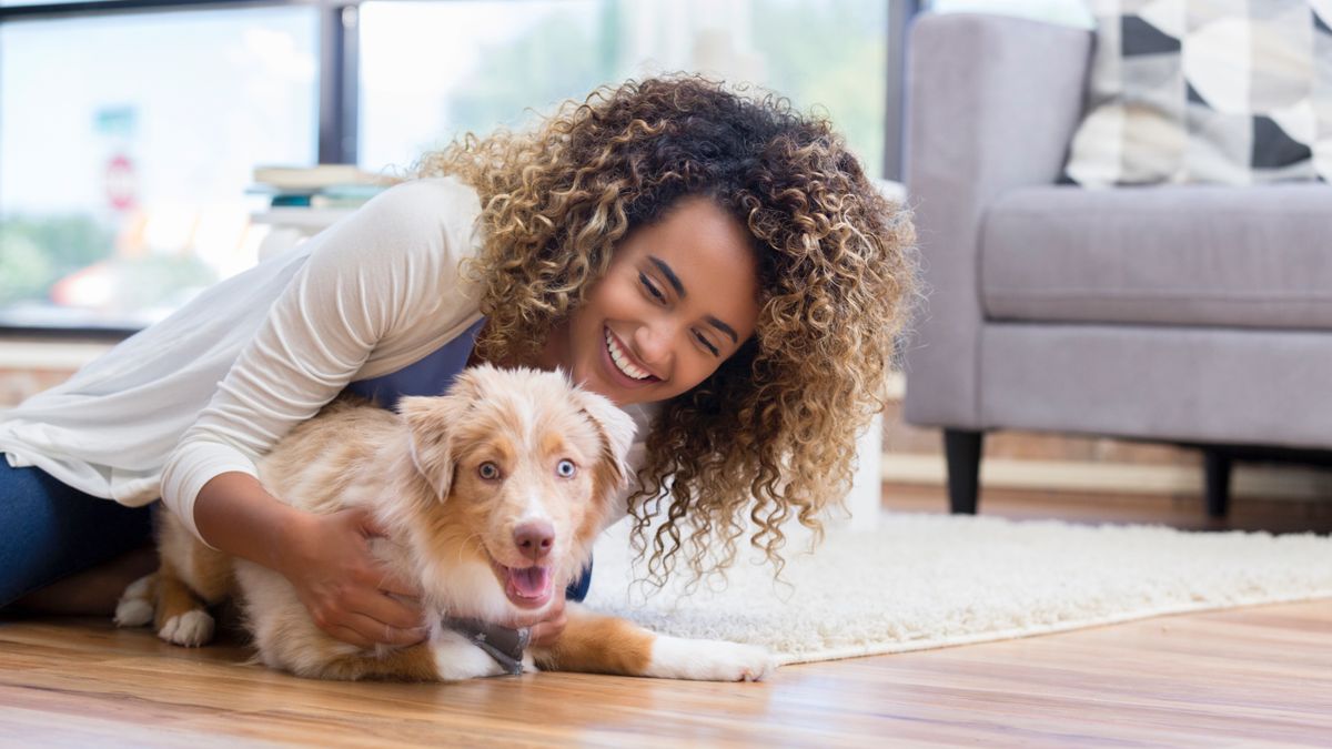 Woman playing with puppy