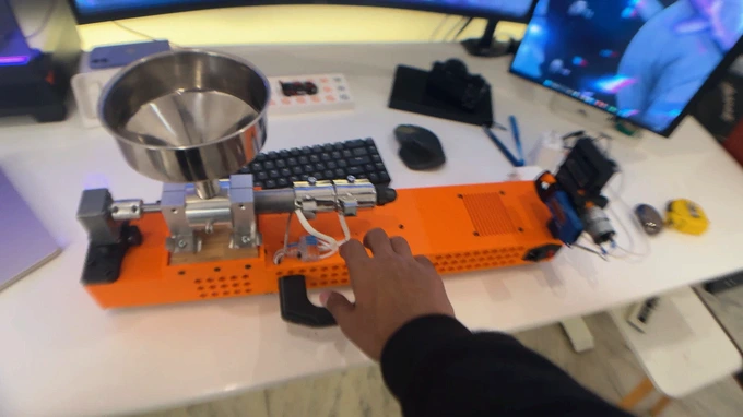 The ExtrudeX being picked up and taken across the room with its built-in handle