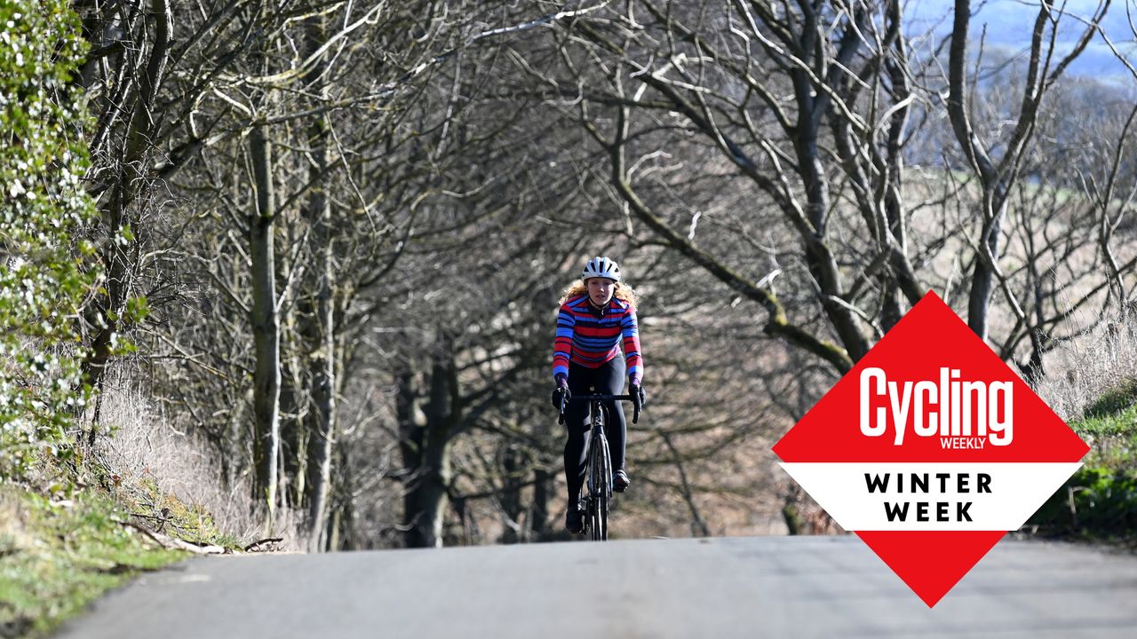 Female cyclist riding outside during the winter