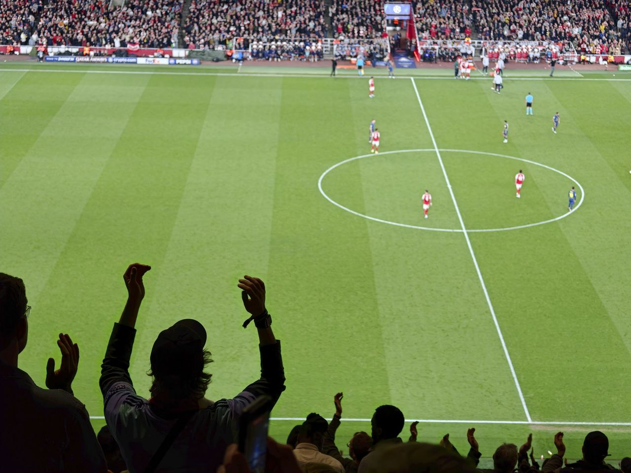 Action photos during a Champions League soccer match at Arsenal's Emirates stadium, taken with the Oppo Find X9 Ultra and teleconverter lens