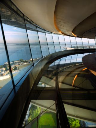 A photo overlooking the city from inside the Space Needle's glass windows.