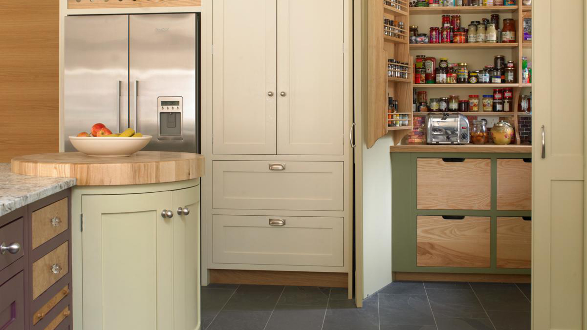cream country kitchen with corner pantry design with retractable doors