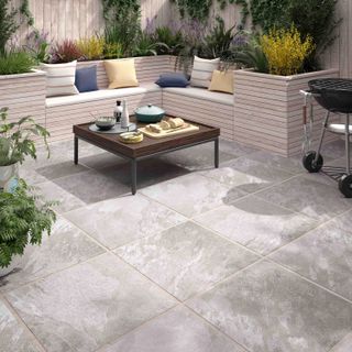 paved patio with built-in corner seating