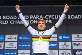 Finn celebrates after winning the rainbow jersey