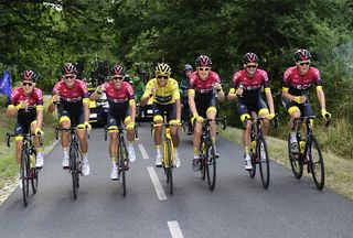 Egan Bernal in yellow surrounded by Team Ineos stage 21 at the Tour de France
