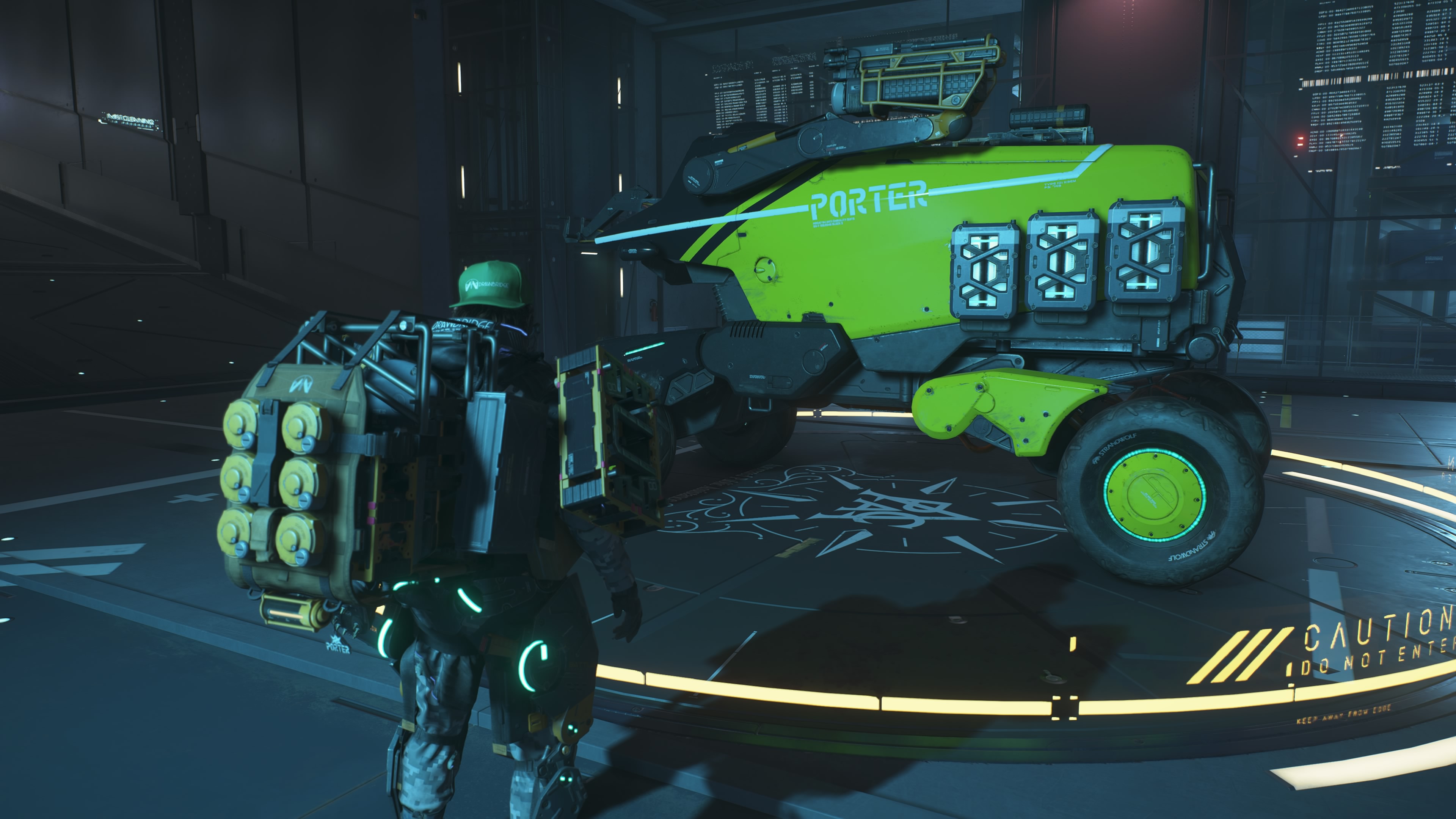 Death Stranding 2 vehicles: Sam standing next to a Pickup Offroader parked inside a garage.