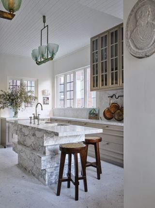 White kitchen with marble island