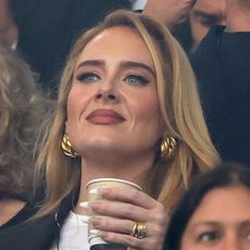 Adele wearing chunky gold earrings at the UEFA Championships games in Germany July 2024