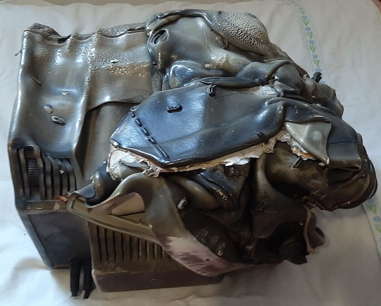 Side view of melted Alcatel Minitel 2