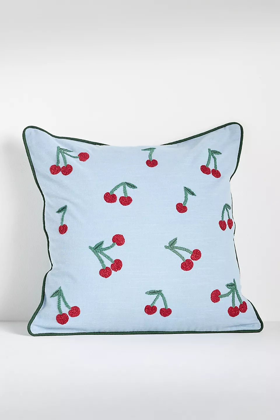 Cherry throw pillow in pale blue