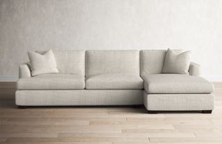 An off-white chaise sectional sofa
