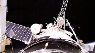 Russian cosmonauts Sergei Zalyotin and Alexander Kalery perform the final spacewalk outside of the space station Mir on May 12, 2000.