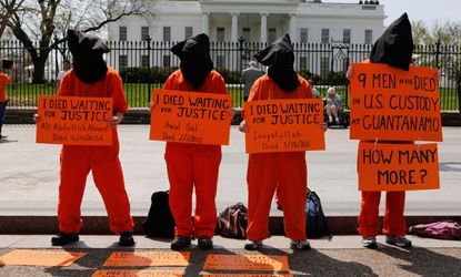 Activists gather in front of the White House on April 11 to demand the closing of Guantanamo Bay.