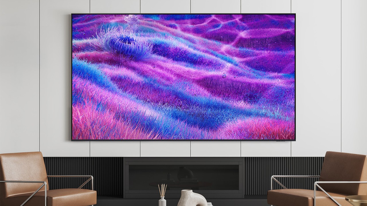 A 100-inch TV wall mounted in a modern living room setting.