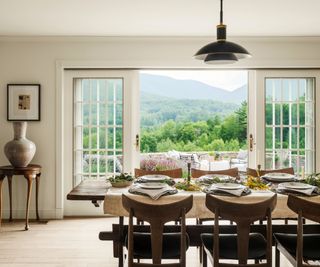 dining room with wooden table and view over mountains