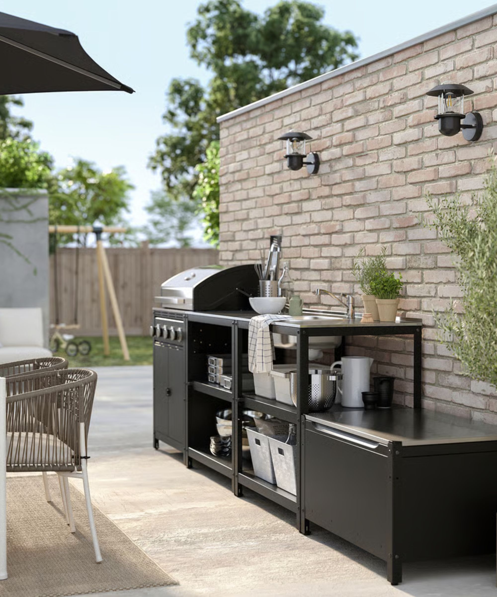 IKEA's Grillskar outdoor kitchen featuring two shelf units and a grill against a brick wall