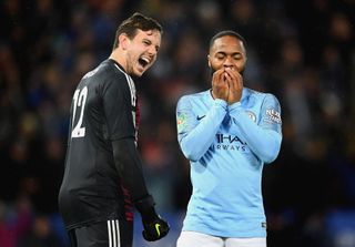 Leicester City goalkeeper Danny Ward laughs at Manchester City's Raheem Sterling after he sends a Panenka penalty over the crossbar in a Carabao Cup quarter-final shootout in December 2018.