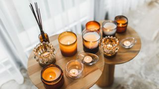 side tables with various lit candles on them