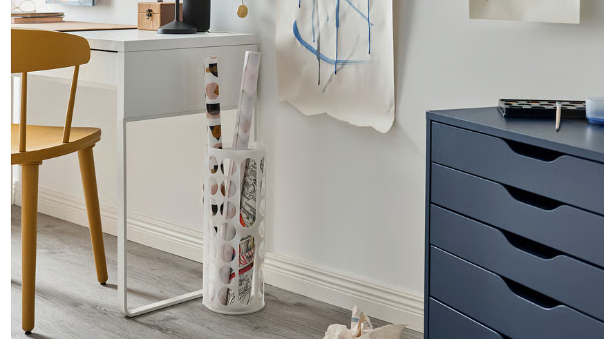 IKEA variera-plastic-bag-dispenser holding gift wrap rolls