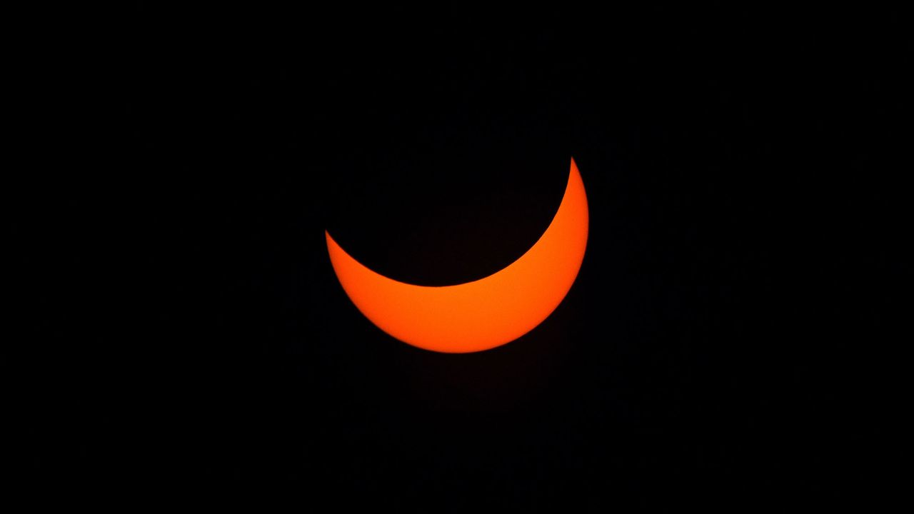 View of the sun partially covered by the moon during the partial solar eclipse in Buenos Aires on Dec. 14, 2020.