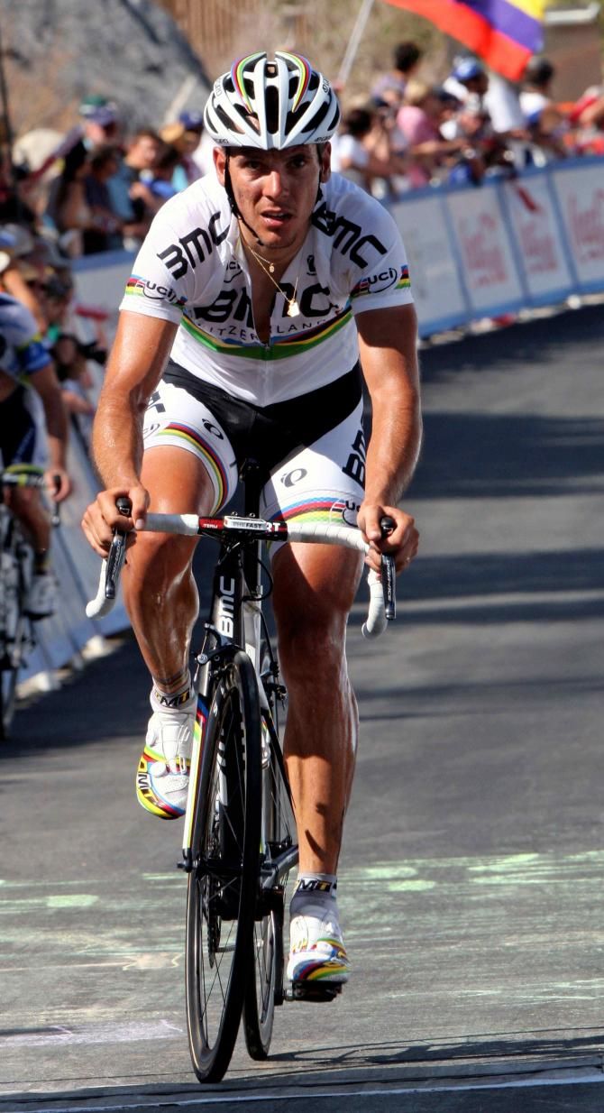 Road world champion Philippe Gilbert (BMC) crosses the finish line after helping to split the bunch at the base of the climb