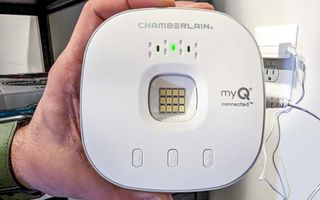 Image of the My Q Chamberlain smart garage controller in someone's hands