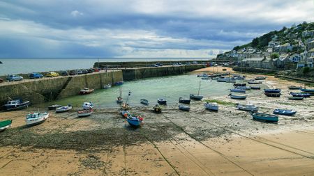 Harbour with fishing boats, sea in the background