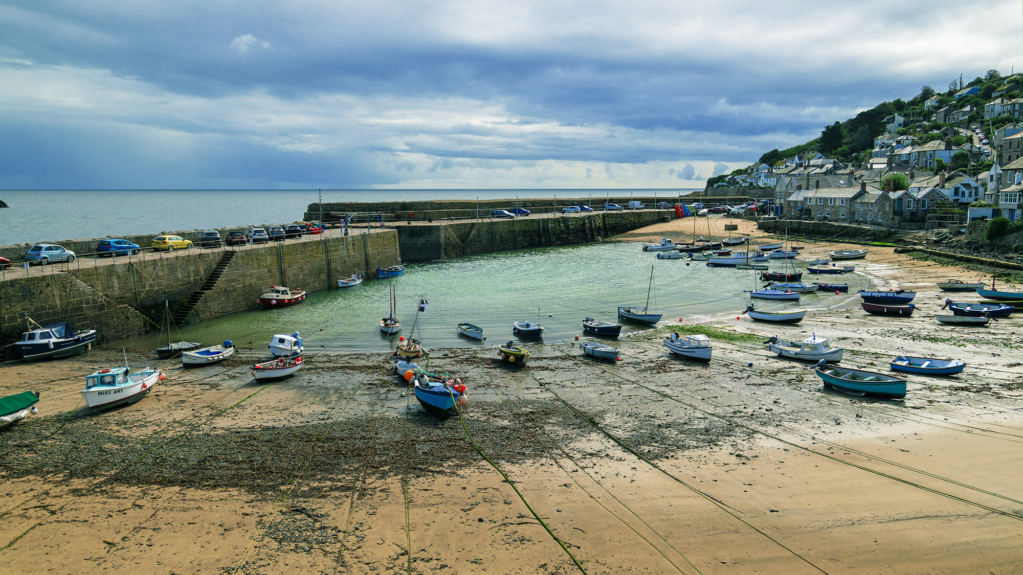Harbour with fishing boats, sea in the background