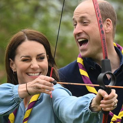 Kate Middleton, Prince William, and Prince George take part in archery at the Big Help Out on May 8, 2023.