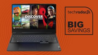black gaming laptop against orange background