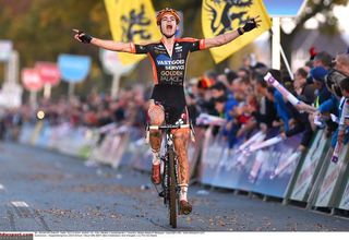 Wout Van Aert (Vastgoedservice - Golden Palace Cycling Team) gives a victory salute after winning Koppenbergcross