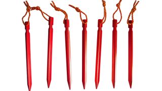 Seven red aluminum tent stakes